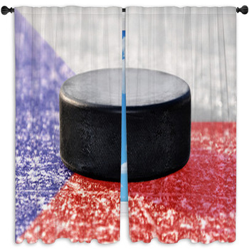 Black Hockey Puck On Ice Rink With Czech Window Curtain