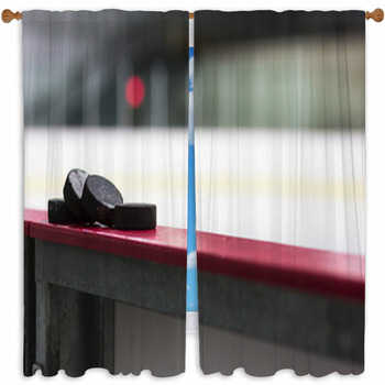 Hockey Pucks Resting On The Custom Size Window Curtain