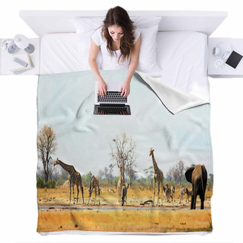 https://www.visionbedding.com/images/theme/panorama-view-of-makololo-waterhole-teeming-with-wildlife-including-giraffes-elephants-and-zebras-heat-haze-is-visible-hwange-national-park-zimbabwe-fleece-bed-cover-229048068.jpg